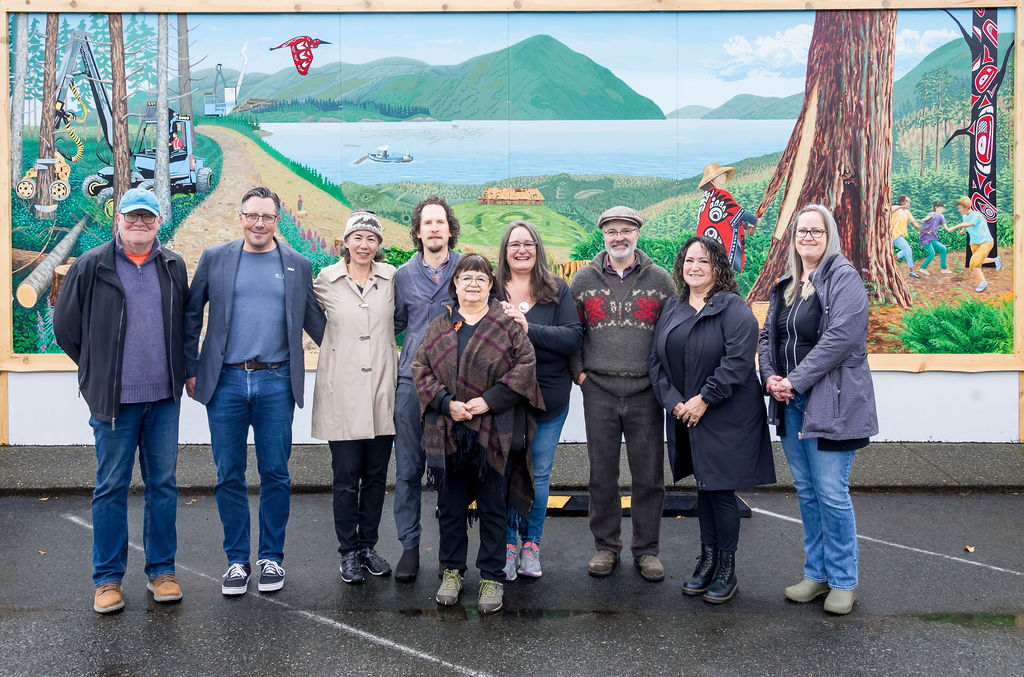 L to R: Back Row - Councillor Jeff Bateman (District of Sooke), Trevor Joyce (Moasic Forest Management), Mayor Maja Tait (District of Sooke), Diego Narvaez (Artist), Shelley Davies (Artist), Councill Tony St-Pierre (District of Sooke), Councillor Rose Dumont (T’Sou-ke Nation), Councillor Bonnie Hill (T’Sou-ke Nation); Front Row: Elder Jackie Planes (T’Sou-ke Nation) 